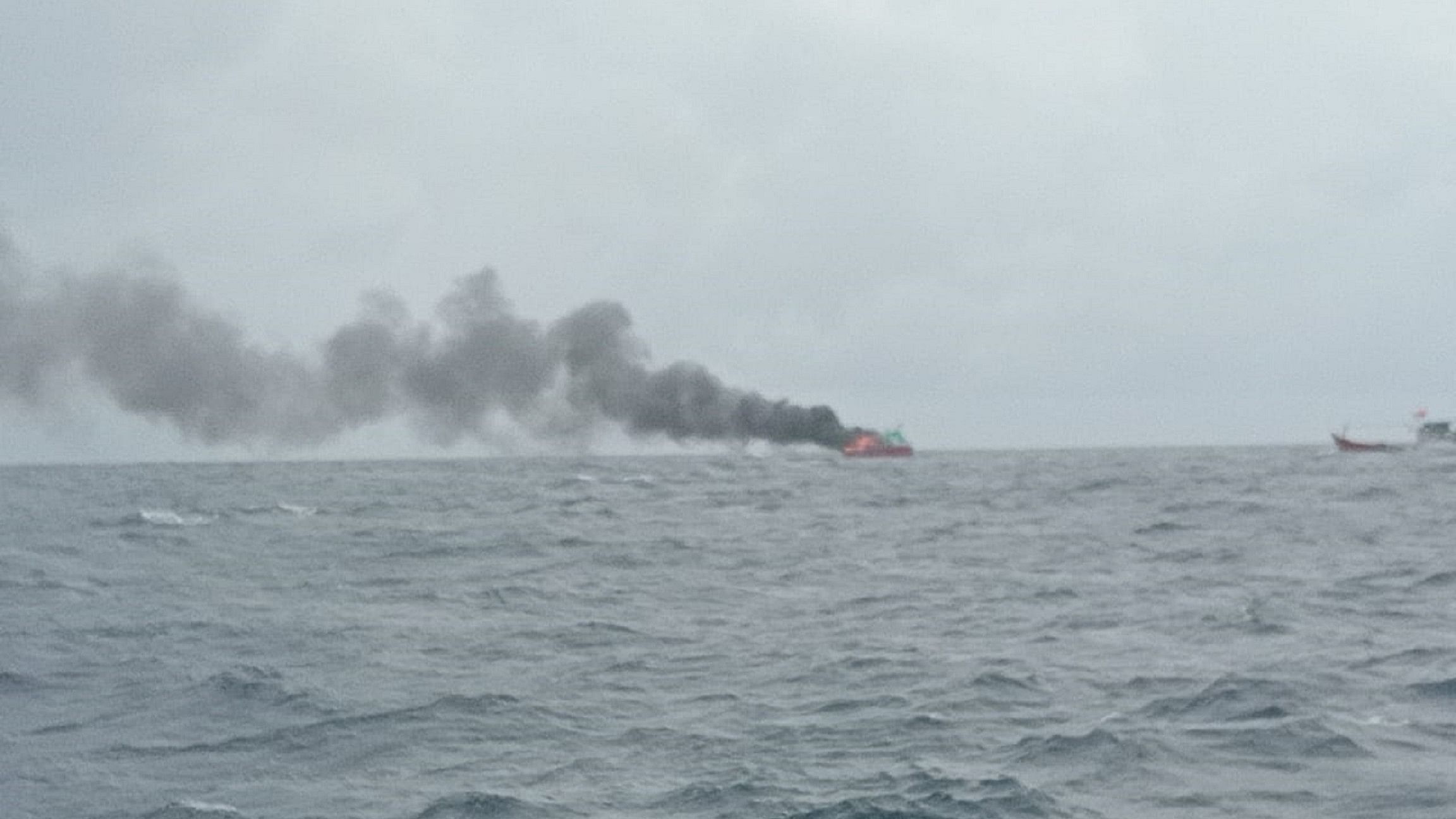 <div class="paragraphs"><p>Smoke from the trawl boat that caught fire in the Arabian Sea.</p></div>